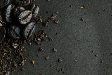 Fototapeta na wymiar The coffee roasted on black texture close up background..