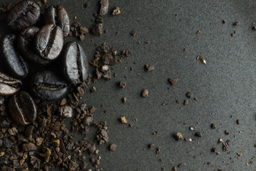 The  coffee roasted on  black texture close up background..