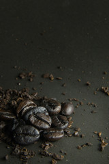The  coffee roasted on  black texture close up background..