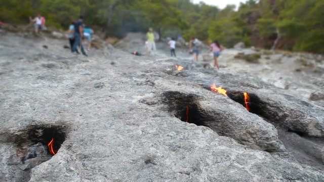 fire burns from under the stones
