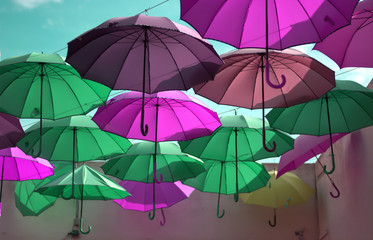 Fototapeta na wymiar wonderful colorful umbrellas like the rainbow take flight to the sky