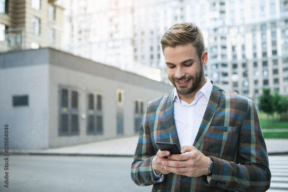Poster internet communication. happy man is typing message on his smartphone with excitement while relaxing