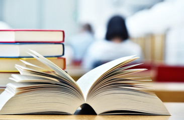 Books lying on the table in the public library