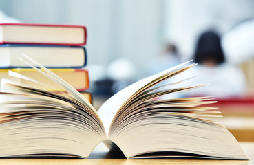 Books lying on the table in the public library