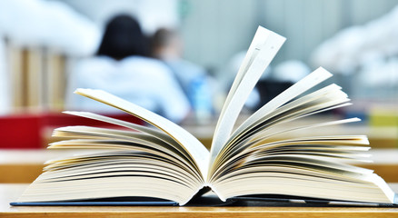 Books lying on the table in the public library