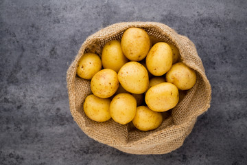 A bio russet potato wooden vintage background.