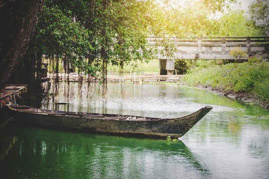 old wooden boat flooding at famous canal at countryside in Thailand