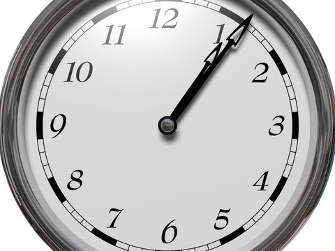 Large clock face with hands that mark the hours on white background