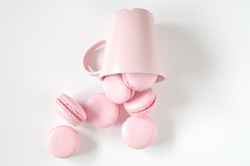 Pink macaroons on white background. Sweet background. Flat lay, top view, copy space 