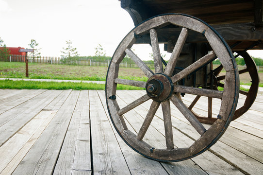 Wooden wheel of old cart
