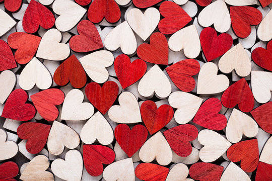 Background with wooden hearts, place for text.