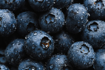 Top view macro shot of fresh blueberry with water drops