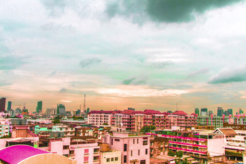 Bird view over cityscape with sun and clouds in the morning.Copy space.Bangkok.Pastel tone.