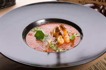 Red thick chowder soup with shrimps