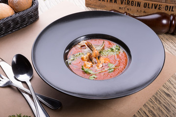 Red thick chowder soup with shrimps