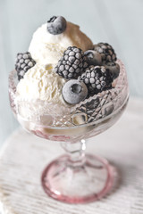 Vanilla ice cream with fozen berries