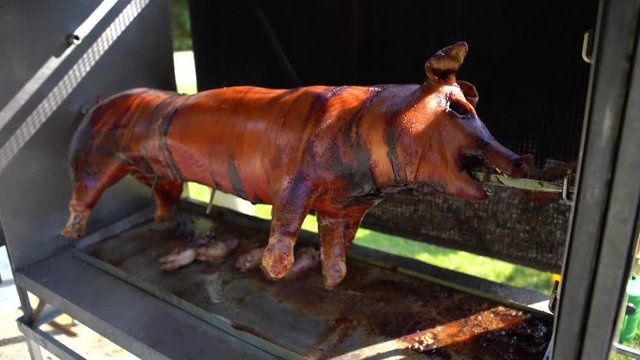 Suckling pig roasting in stove