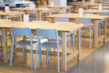 Interior of wooden table in food court shopping mall. Food center in department store.