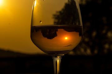 Glass of wine with Reflections, reflecting scenery and yourself!