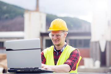 Engineer working with laptop 