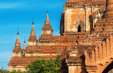 View of a Buddhist temple against a blue sky in Bagan, Myanmar. Copy space for text.