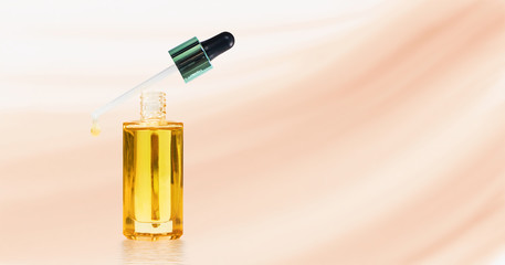 Cosmetic bottle with oil primer for face.