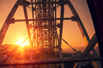 Ferris wheel at sunset in Tbilisi city, Georgia. View from Ferris wheel