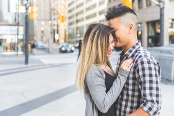 Asian couple in love togheter in the city