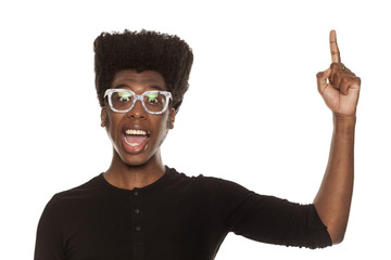 young handsome afro american guy stylish hipster pointing up happy isolated on white background. advertising concept