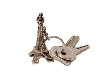 Keychain and apartment keys on a white background