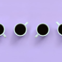 Many small white coffee cups on texture background of fashion pastel violet color paper in minimal concept