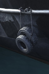 two black wheels on a part of the ship