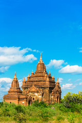 Fototapeta premium View of ancient pagodas in Bagan, Myanmar. Copy space for text. Vertical.