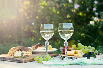 White wine and light snacks, Grapes, wine, cheese, pie.