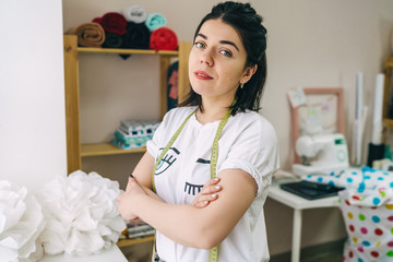 Young Fashion designer working in studio