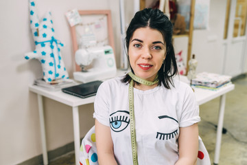 Portrait of Young Fashion designer working in studio
