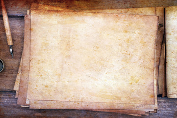 Fototapeta na wymiar old paper on brown wood texture with pen and ink.