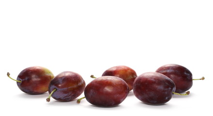 Fresh plums isolated on white background