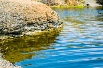 Nature, landscape, water on the ground in spring and summer. Bright saturated colors of the river, the lake.