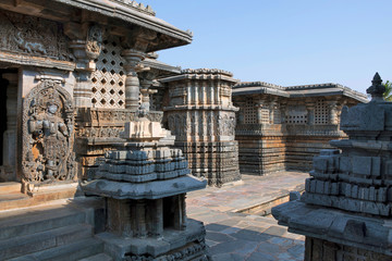 Obraz premium Small towers and dwarapla at the Shantaleswara shrine, Hoysaleshvara Temple, Halebid, Karnataka, View from South East.