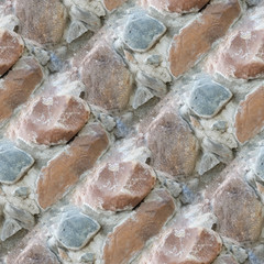 Seamless photo texture of building wall from stones in cement