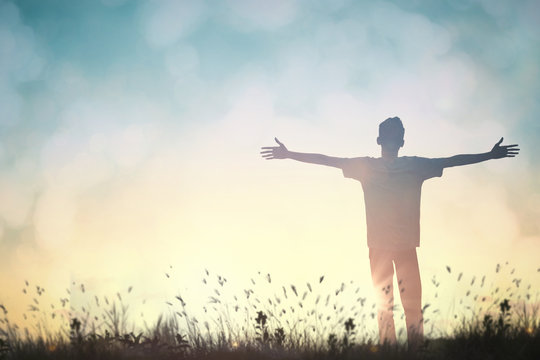 Happy man rise hand on morning view. Christian inspire praise God on good friday background. Now one man self confidence on peak open arms enjoying nature the sun concept world wisdom fun hope