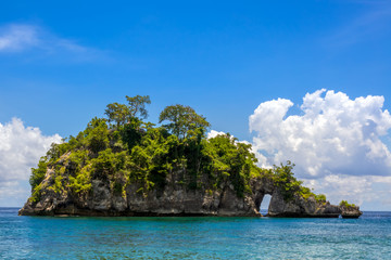 Fototapeta na wymiar Rocky Tropic Islet in Indonesia