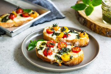  Mozzarella with Cherry Tomatoes and Basil Pesto on toasts