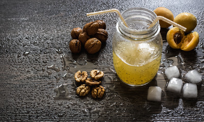 Fototapeta na wymiar The walnut, juice, ice and apricot