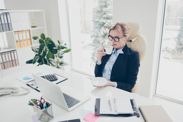 Portrait of stylish pretty lawyer in shirt jacket drinking hot beverage enjoying free time watching...