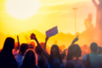 Fototapeta premium Crowd at summer music festival, blurred people during concert