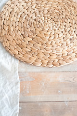 A large textured table in the ecological style and Loft style. Rustic wicker napkins, light green tablecloth, diy. White textured kitchen in the style of shabby.