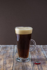 Glass of dark beer.