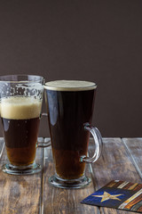Glasses of dark beer.